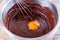 Mixed yolk eggs and chocolate for baking cake or bake.