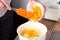 Mixing citrus peels with cake dough.