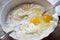 Mixing eggs cake flour and butter to prepare a sponge cake