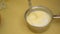 Mixing flour with a mixture of whipped eggs and sugar - Making egg sponge