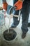 Mixing of a plaster solution by an electric drill. Home renovation. Workers mixed tile adhesives in buckets