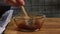 Mixing spices for guacamole with vegies recipe