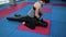 MMA fighter practicing with sports dummy in gym