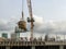 Mmoving liquid concrete into the tower crane bucket at the construction site sanpada Navi Mumbai