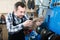 Mn worker repairing footwear in repair workplace