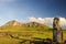 Moai located at Tongariki\\\'s entrance with Rano Raraku volcano at the background