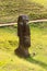 A moai on the outer slopes of Rano Raraku volcano. Rano Raraku is the quarry site where the moais were carved. Easter Island,