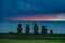 Moai shilouette in the Ahu Tahai at sunset against deep blue sky