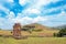 Moai statues at the Ahu Akivi Ceremonial complex on Easter Island, against a blue sky.