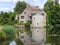 Moat house on the edge of a lake