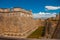 Moat and walls of the old fortress. Fort Castillo del Moro. Castle San Pedro de la Roca del Morro, Santiago de Cuba