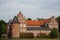 Moated castle full view, fall season landscape