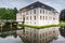 Moated Castle Norderburg with Reflection in Water Ditch, Dornum, East Frisia, Germany