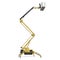 Mobile aerial work platform - Yellow scissor hydraulic self propelled lift on a white. Side view. 3D illustration