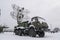 mobile air defense truck with radar antenna. Satellite dishes or radio antennas sky