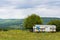 Mobile apiary trailer in meadow. View of Adygea republic nature, Russia