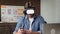 Mobile app developer testing his futuristic app concept using VR headset