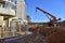 Mobile auto crane during pouring the formwork of the porch at the entrance of a residential building. Frame of reinforcement,