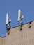 Mobile communication antennas on the wall of a building