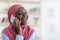 Mobile Communication. Cheerful Black Muslim Woman Talking On Cellphone, Closeup Shot