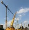 Mobile crane installing the main pillars of the new building