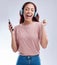 Mobile, headphones or happy woman dancing to music or singing radio songs in studio on white background. Dance, smile or