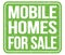 MOBILE HOMES FOR SALE, text written on green stamp sign