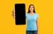 Mobile Mockup. Smiling Young Lady With Big Blank Smartphone In Hand