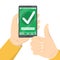 Mobile payment approved. Green checkmark on the smartphone