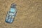 Mobile phone buried in the grey sand