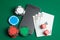 Mobile phone casino online. Mobile phone and game cards with chips and dice on a green gaming table. Gambling addiction