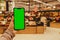 Mobile phone Chroma key for mobile app application. Close up of woman hand holds smart phone with green screen at