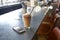 Mobile Phone And Cold Press Coffee On Cafe Counter