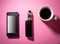 Mobile phone ,electric cigarette and coffe on pink background ,concept of resting or taking a pause