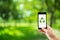 mobile phone holding hand with recycle symbol eco environment