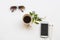 Mobile phone, hot coffee espresso and sunglasses of lifestyle at office arrangement flat lay style