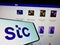 Mobile phone with logo of Arabian carrier Saudi Telecom Company (STC) on screen in front of company website.