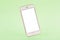 Mobile phone mock up on green pastel background, technology and busiess concept
