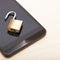 Mobile phone security and data protection concept. Smartphone with a small unlocked lock - close up shot