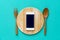 Mobile phone served on wood plate