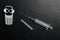 Mobile phone syringe dark leather background