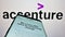 Mobile phone with website of information technology company Accenture plc on screen in front of business logo.