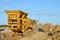 Mobile Stone crusher machine by the construction site or mining quarry for crushing old concrete slabs into gravel and subsequent