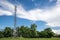 Mobile towers on blue sky,white cloud and tree background.