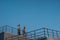 Mobile towers on the roof of a multi-level parking lot at dawn