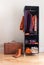 Mobile wardrobe with clothing and leather suitcase