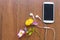 Mobilie phone, earphone and colorful flowers of lifestyle arrangment flat lay syle