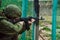 Mobilized Russian soldiers undergo combat training at the training ground. Soldier aims gun