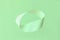 Mobius strip soaring in the air on mint background