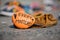 Moccasin and painted orange rock left in memory of aboriginal children